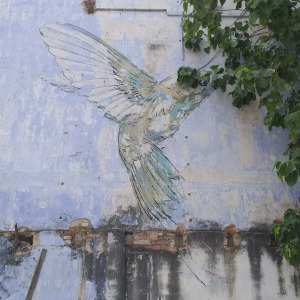 A Yellow Hummingbird by Ernest Zacharevic.
