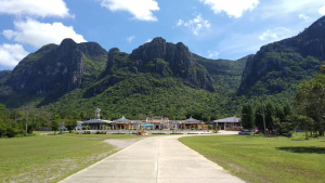 Chinese temple backed by limestone mountains at Khao Sam Roi Yot National Park
