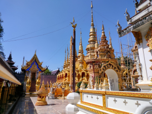 Collection of small Mandalay-style gold pagodas atWat Phra That Suthon Mongkhon Khiri