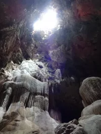 Light shining through roof of Sai Cave