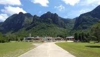 Chinese temple backed by limestone mountains at Khao Sam Roi Yot National Park